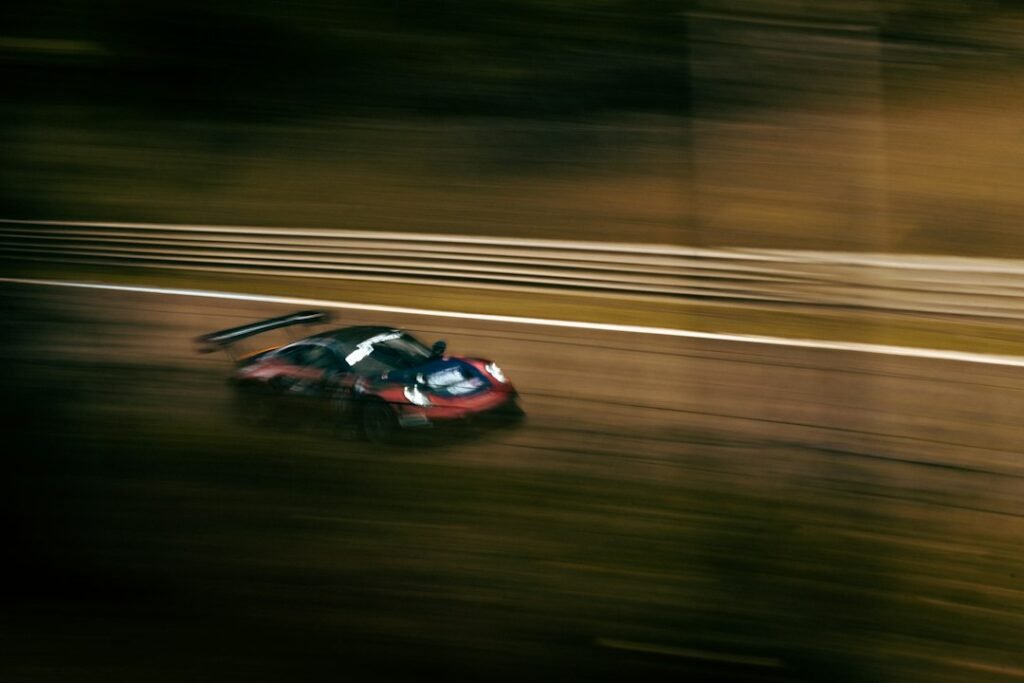 Sports car at a race circuit illustrating arcade racing