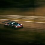Sports car at a race circuit illustrating arcade racing