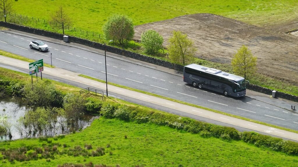 Coach bus on a scenic road for bus simulator comparison