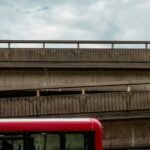 Bus on a road beside a bridge for the Bus Masters India APK download guide