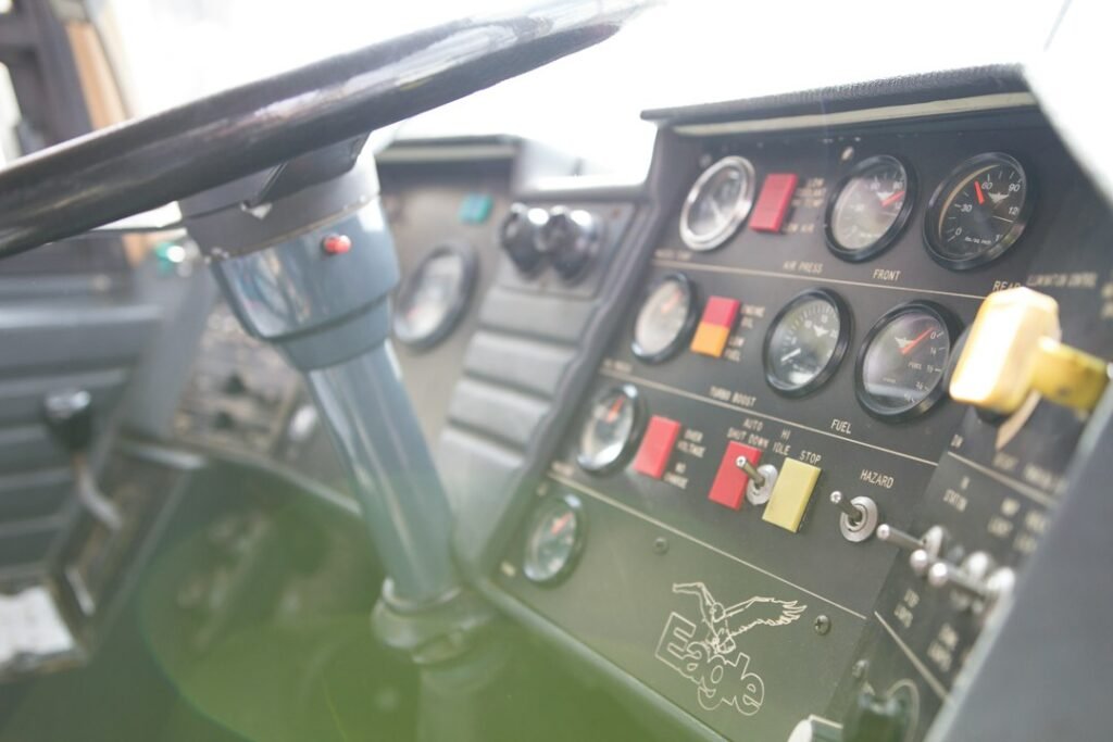 Bus driver cockpit and steering wheel