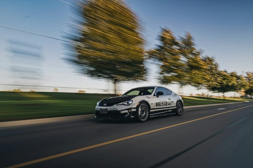 Sports coupe on a road, illustrative image for Extreme Car Driving Simulator