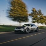 Sports coupe on a road, illustrative image for Extreme Car Driving Simulator