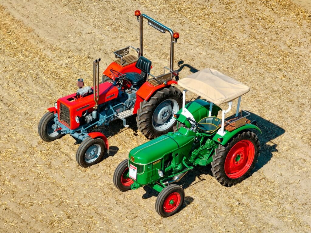 Tractors in a harvested field illustrating mobile farming simulation