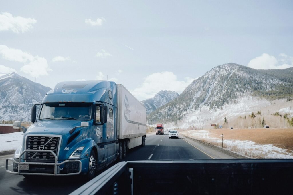 Heavy vehicle driving along a winding mountain road