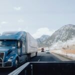 Heavy vehicle driving along a winding mountain road