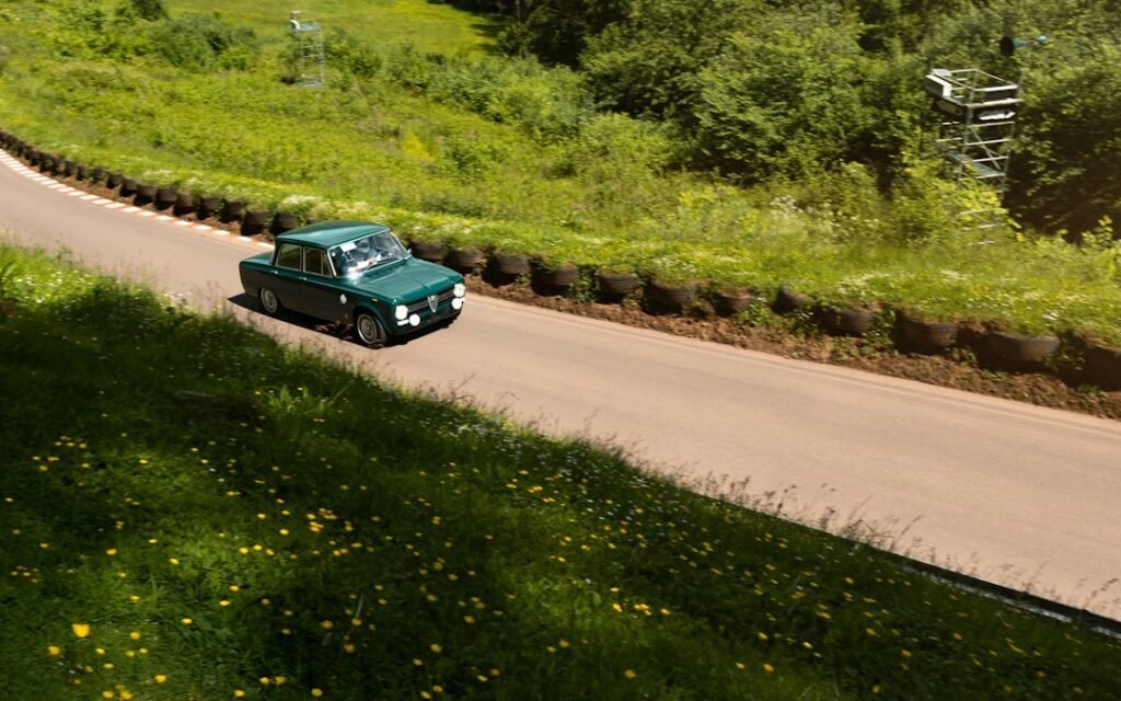 Car on a hilly road illustrating off-road racing