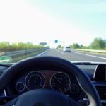 View from inside a car on a highway, illustrative image for Real Driving School